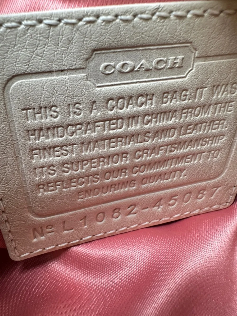 Coach Kristin Signature Crossbody Swing Bag in a metallic gold and beige fabric